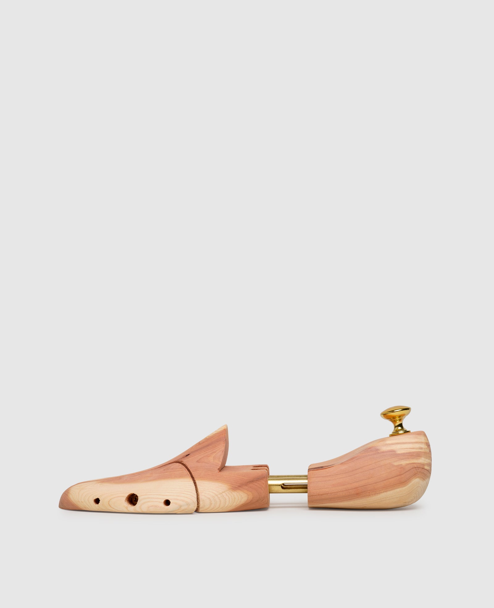 High-quality cedar shoe trees keep shoes in shape. – Henry